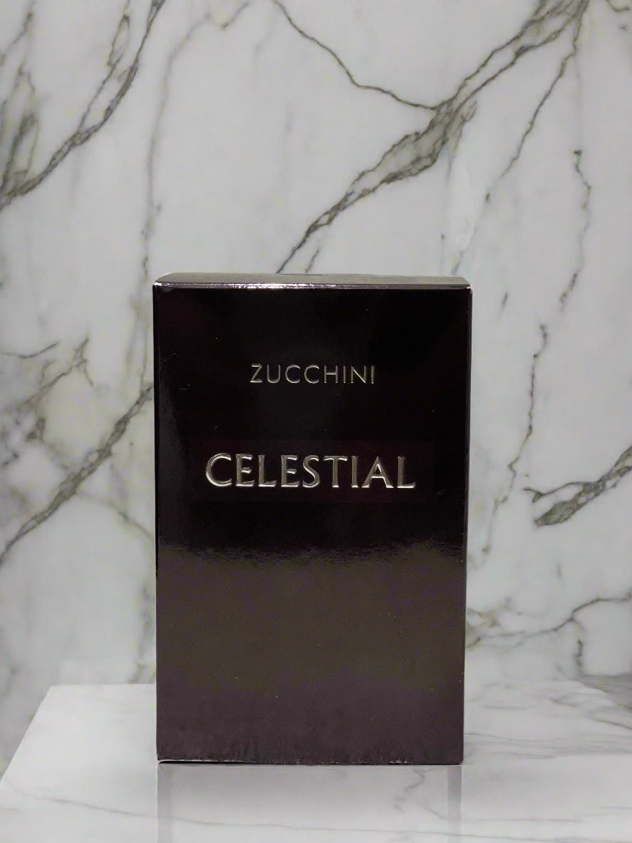 Black box with 'Zucchini Celestial' branding on a textured gray background