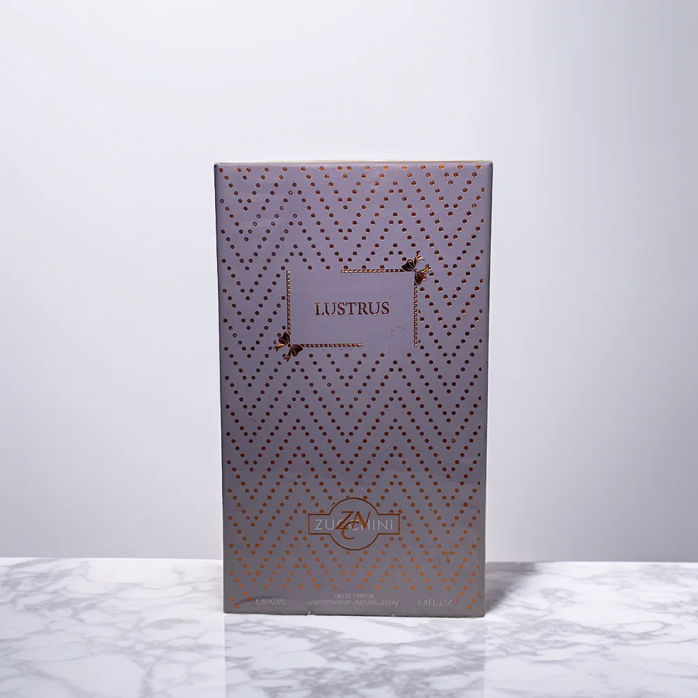 Decorative box with geometric pattern and 'Lustrus' branding on a white marble surface.